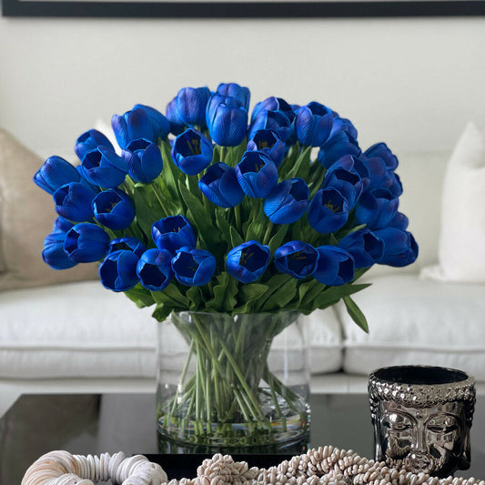 Blue Tulip Arrangement in a Large Cylindrical Vase